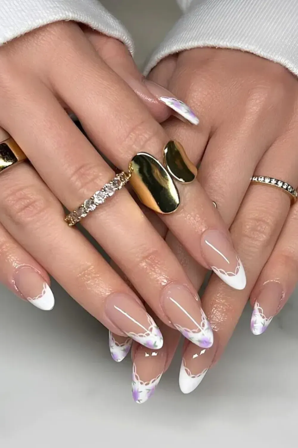 Floral French tips with a nude base