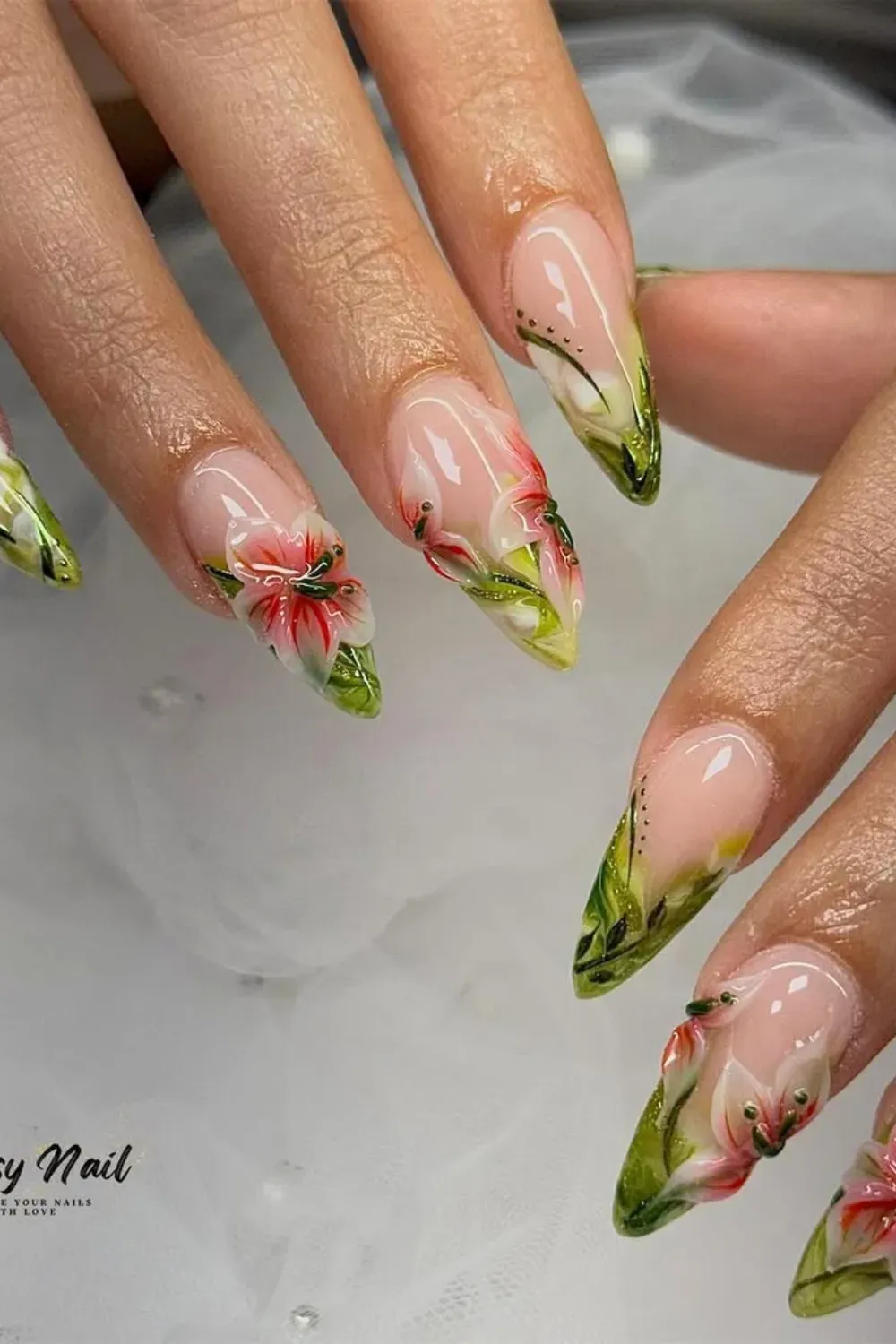 Tropical Floral French Tips Alt Text: French tips with tropical floral accents like hibiscus and plumeria for a vacation-inspired look