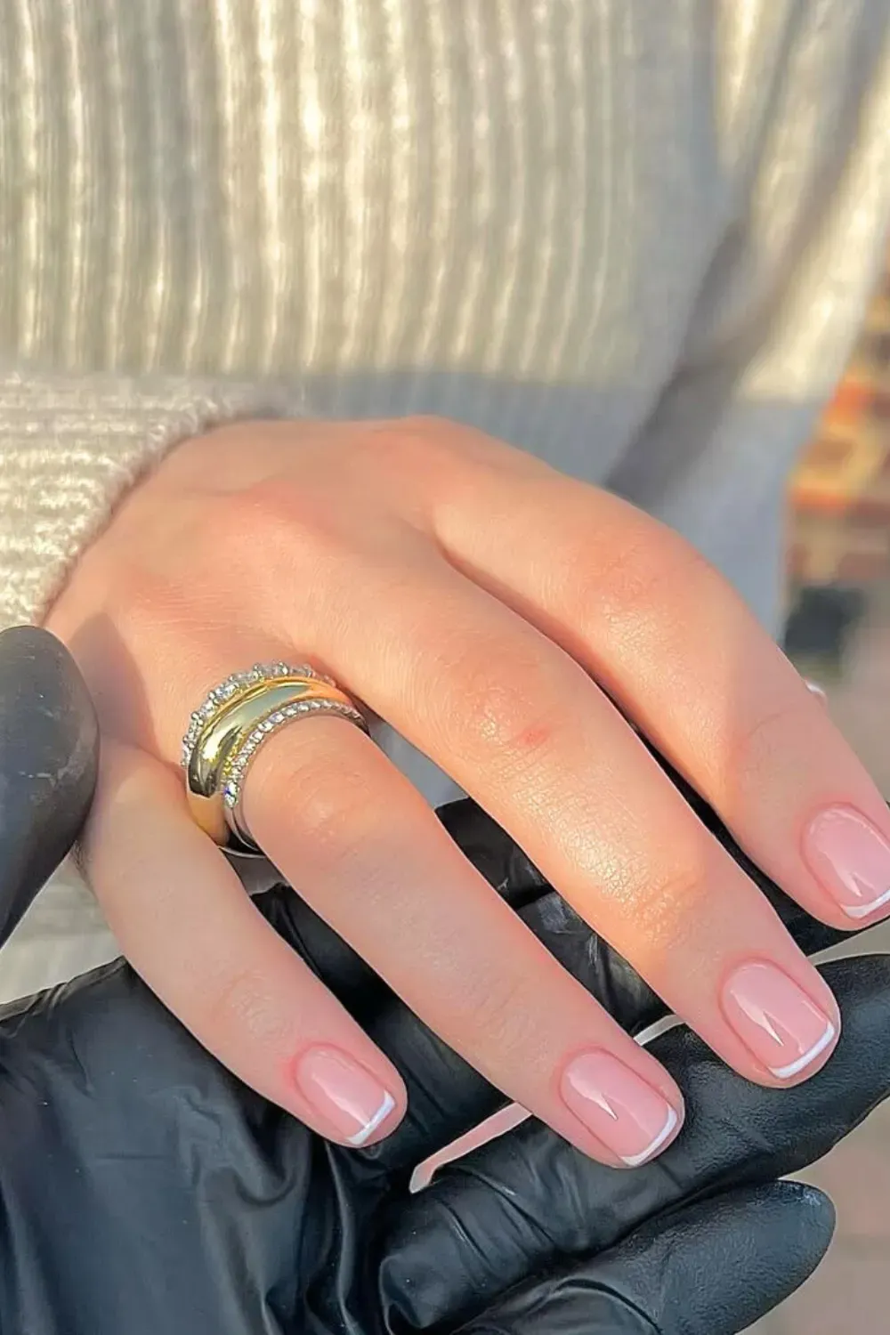 Classic French manicure with a soft pink base and white tips