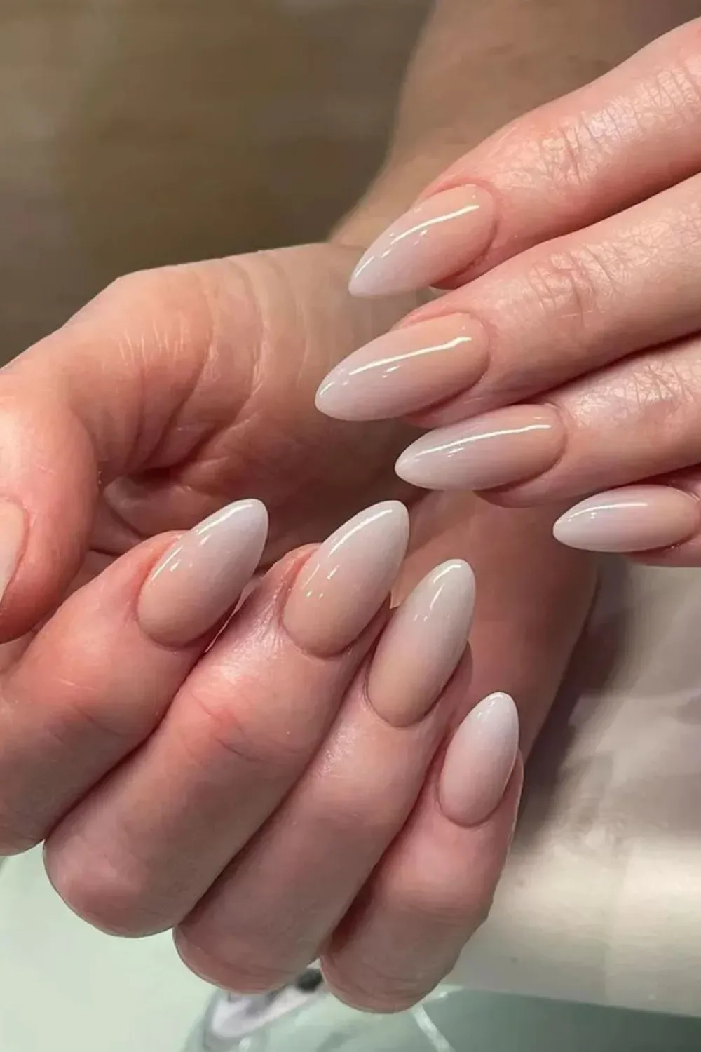 Glossy Nude Almond Nails - Nude almond-shaped nails with glazed finish