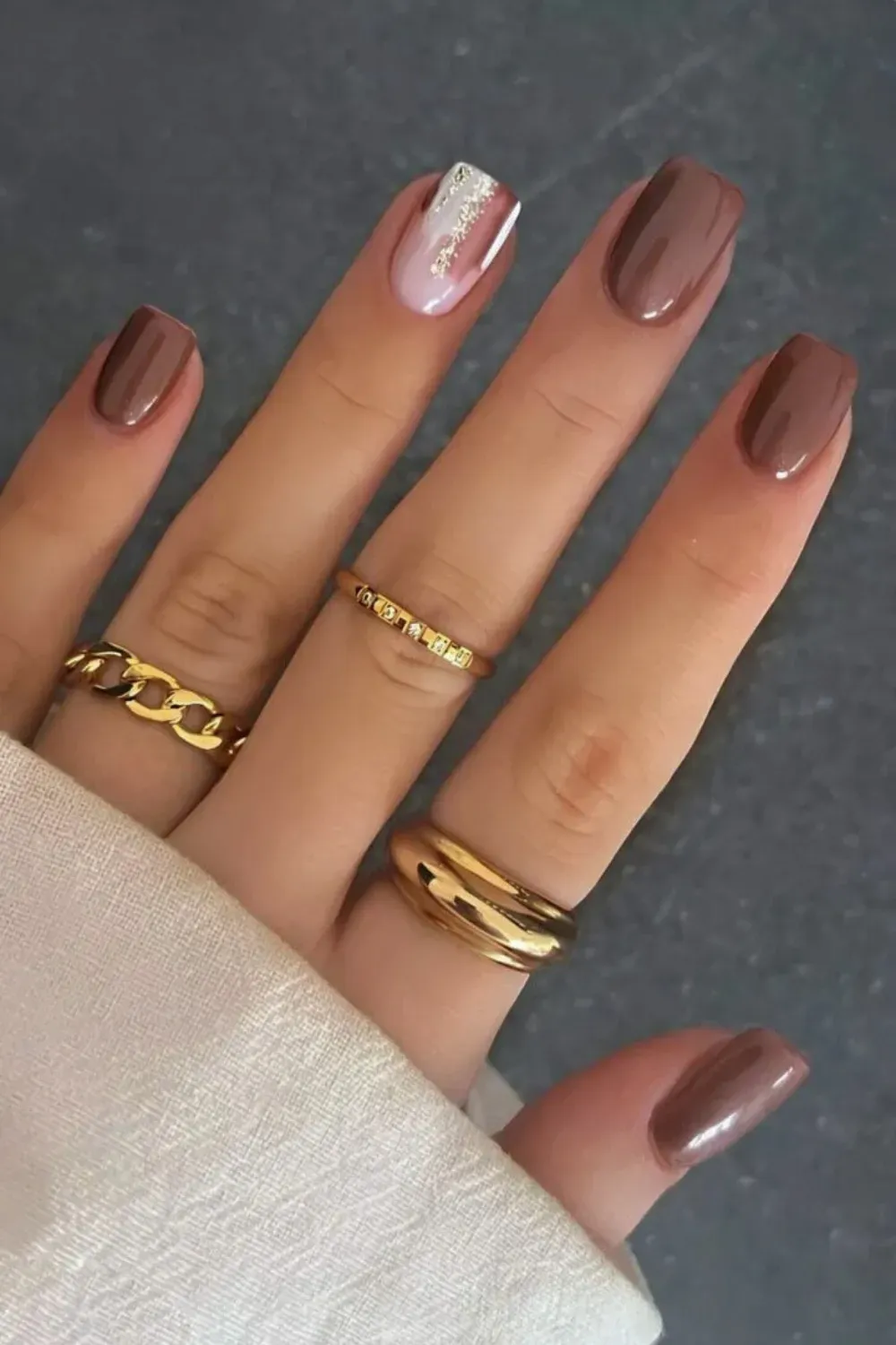 Brown nails with fine glitter topcoat for subtle sparkle