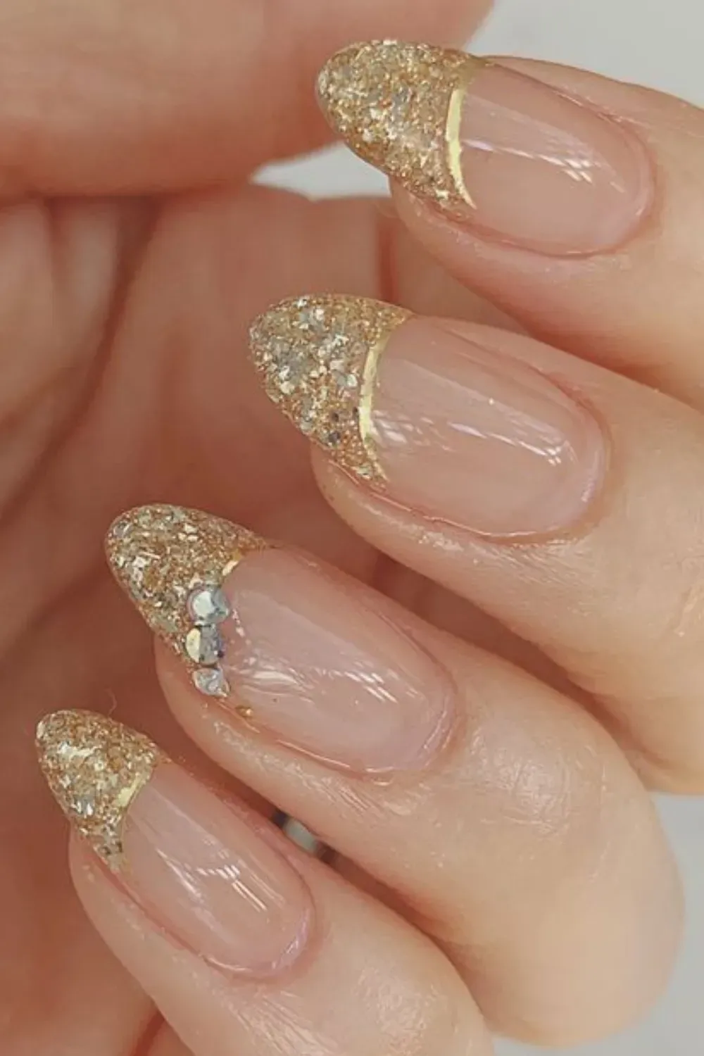 Gold glitter French tips for a glamorous look