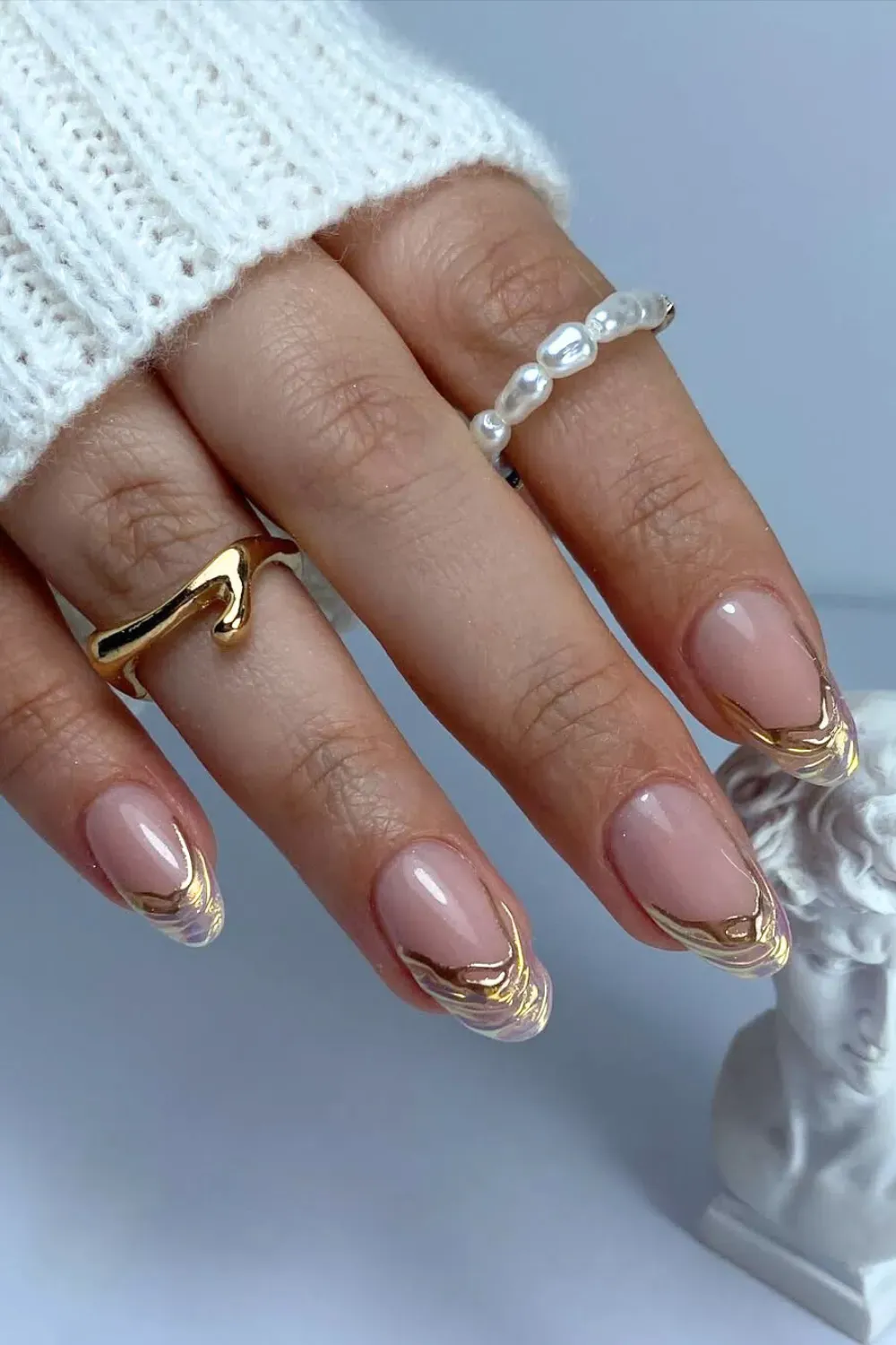 Elegant French tips with gold leaf accents