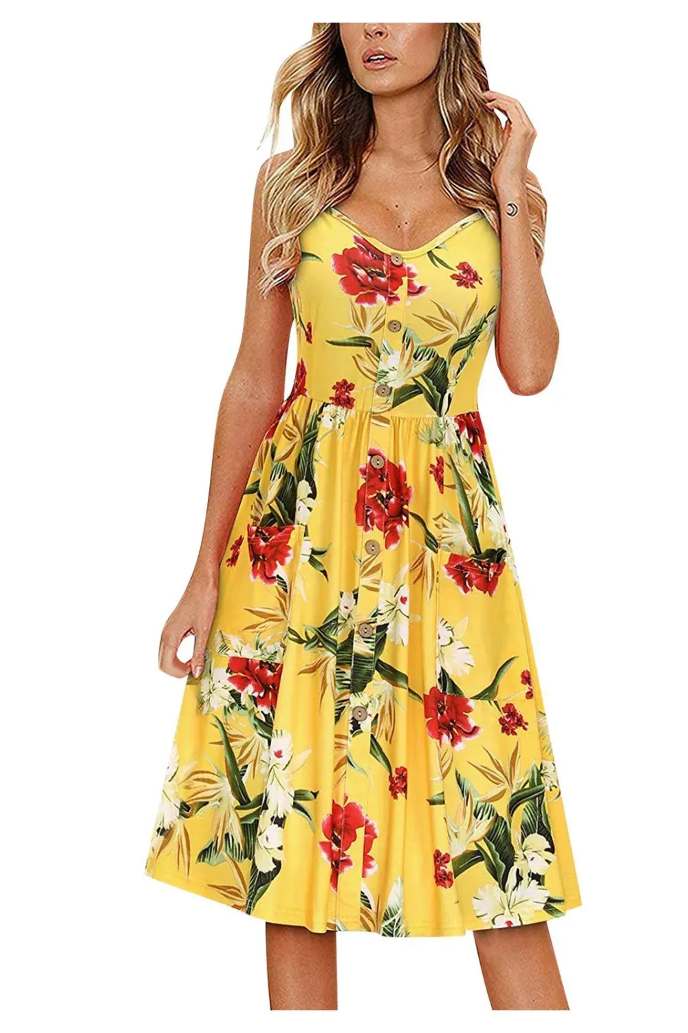 Woman wearing a yellow midi dress with bright tropical flowers.