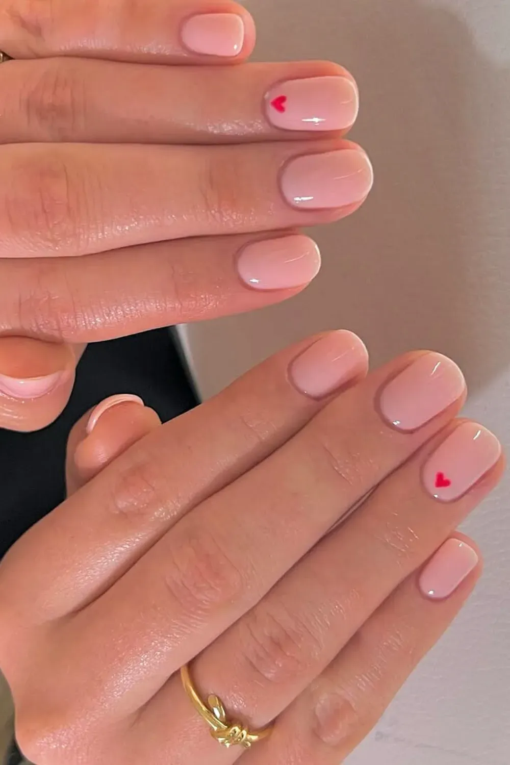 Cute heart accents on a soft pink nail base
