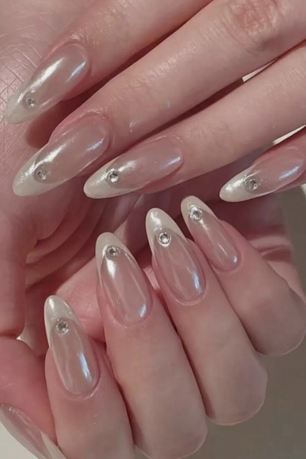 Minimalistic white French tip nails with a neutral base.