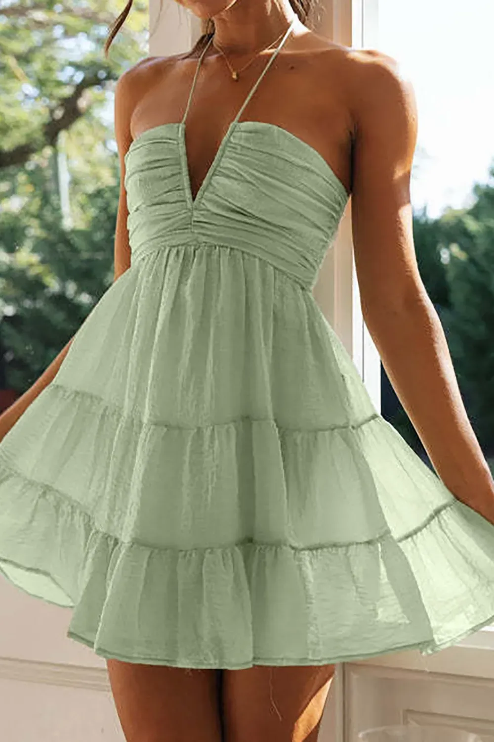 Mint Green Halter Summer Dress with Ruffles - Light mint green halter sundress with tiered ruffles, perfect for warm weather.