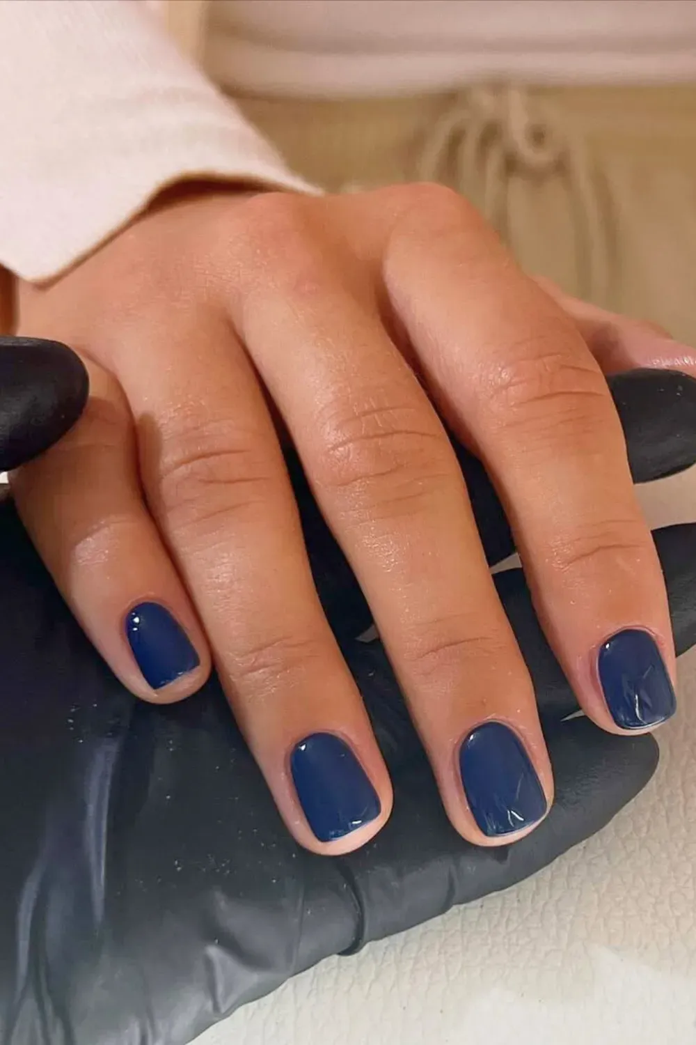 Elegant dark navy blue nails with a glossy finish