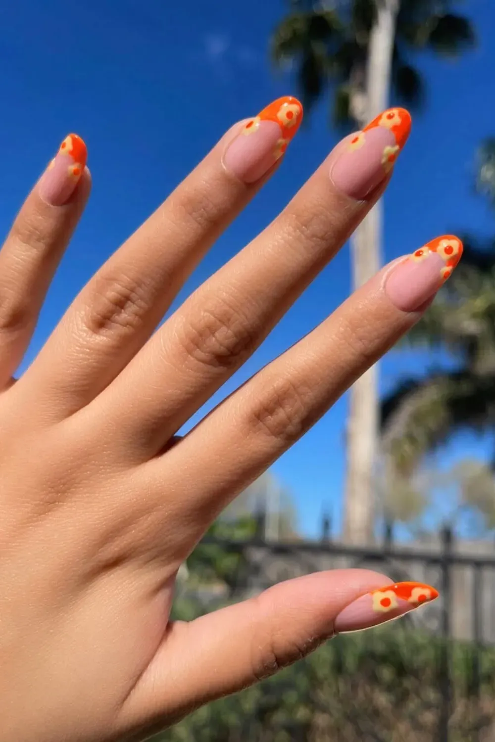 Neon French Tips with Abstract Flowers - Bold neon French tips with abstract floral accents for a vibrant and eye-catching design