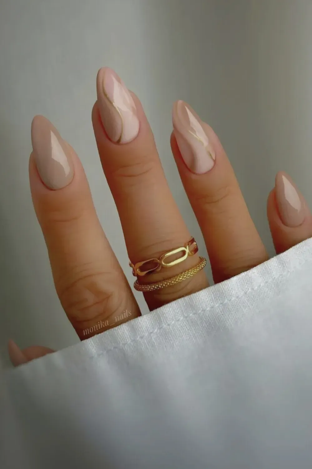 Brown, cream, and caramel swirl pattern nails