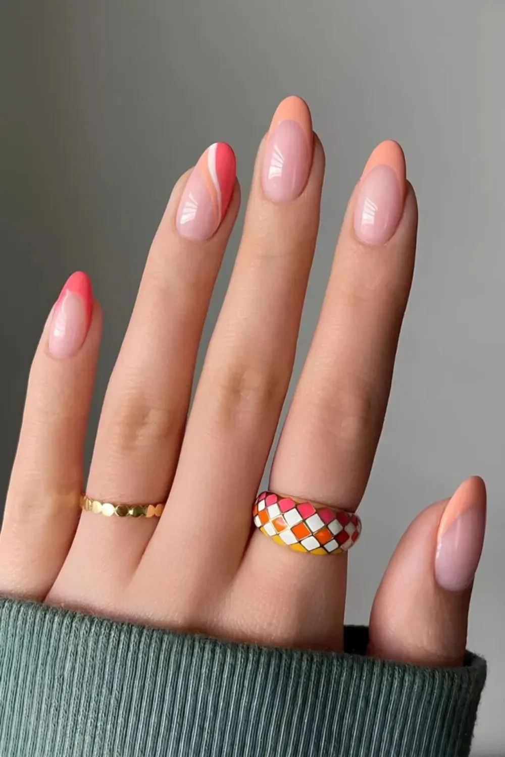Coral and pink gradient French tips for a retro chic look