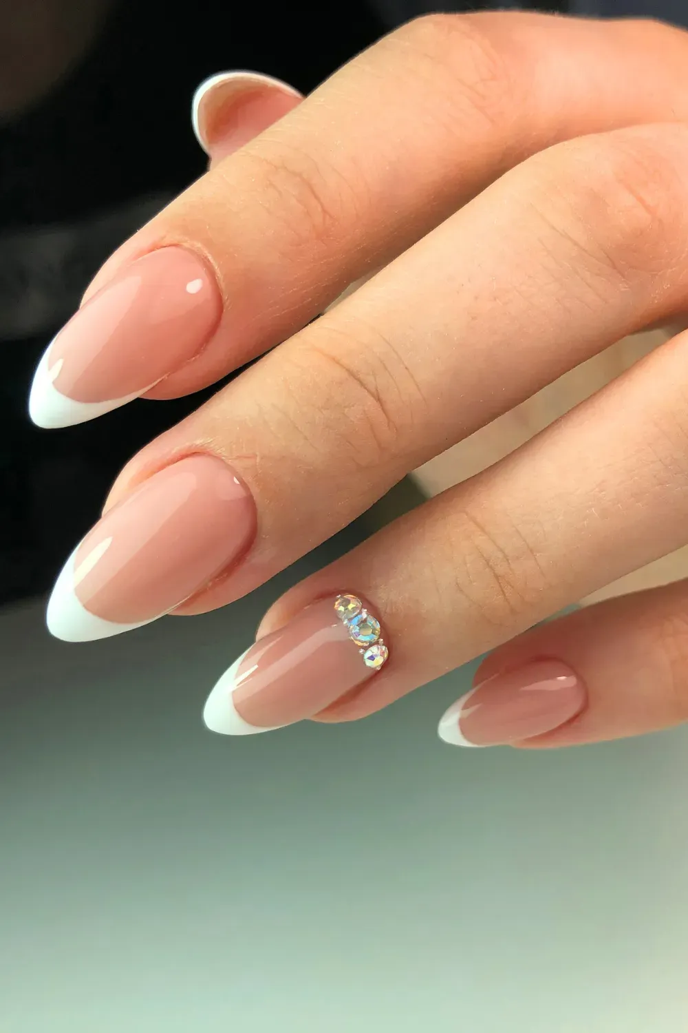 White French Tips with Rhinestone – Classic French tips with a single rhinestone accent