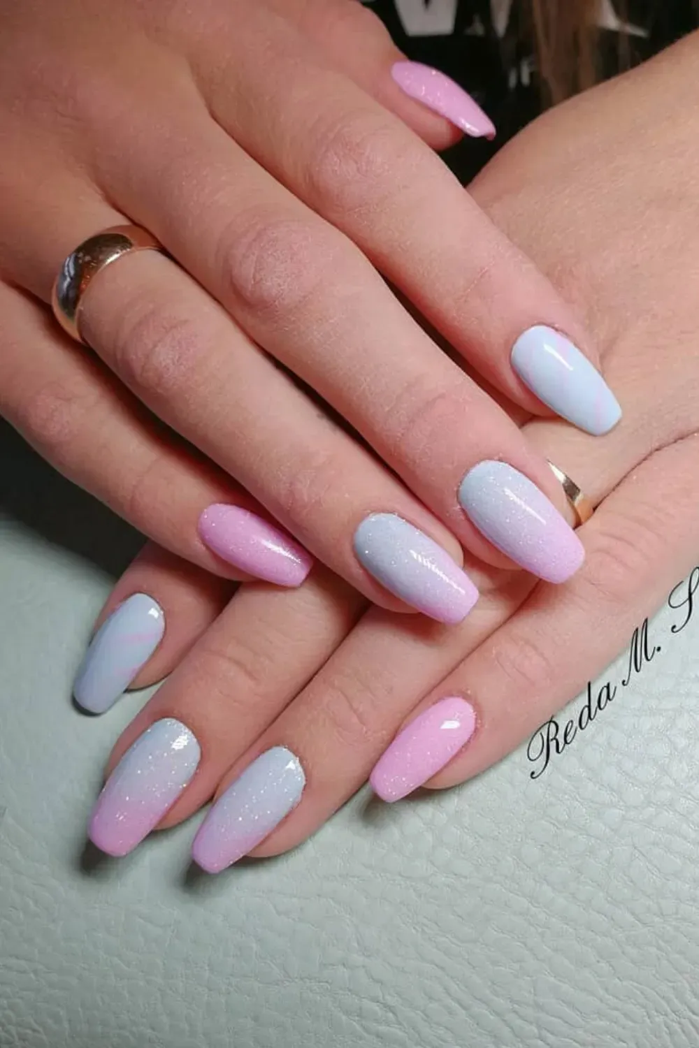 Soft pink to blue ombre nails with a touch of sparkle