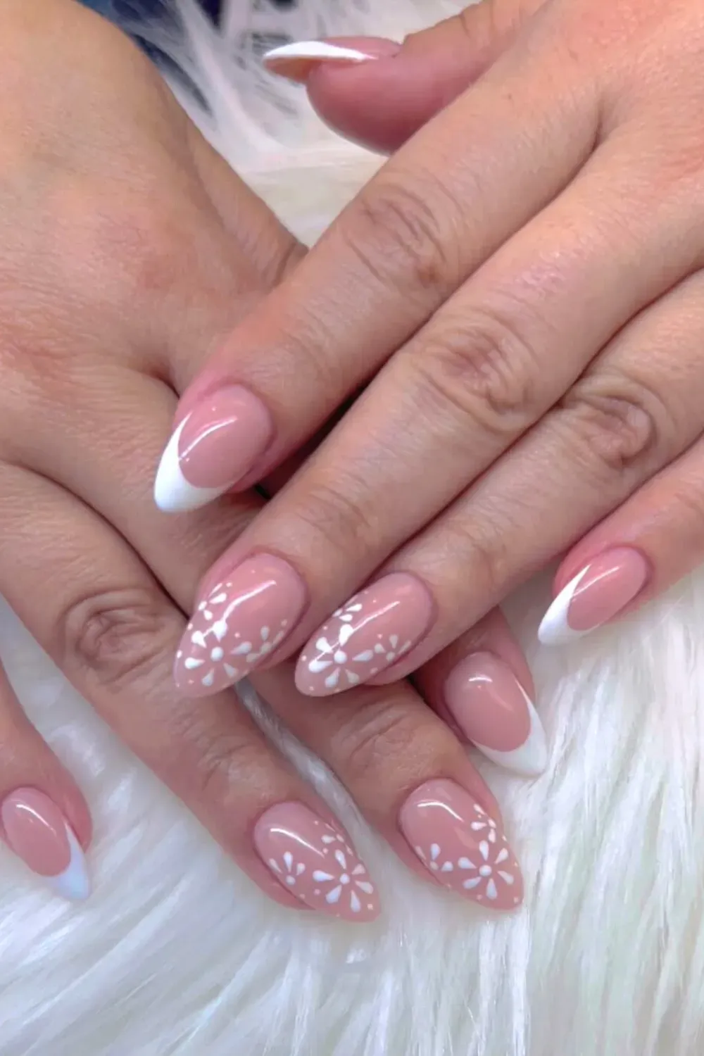 Pink and White French Tips with Bold Floral Accents - Chic pink and white French tips with bold floral accents for a modern twist on the classic design.