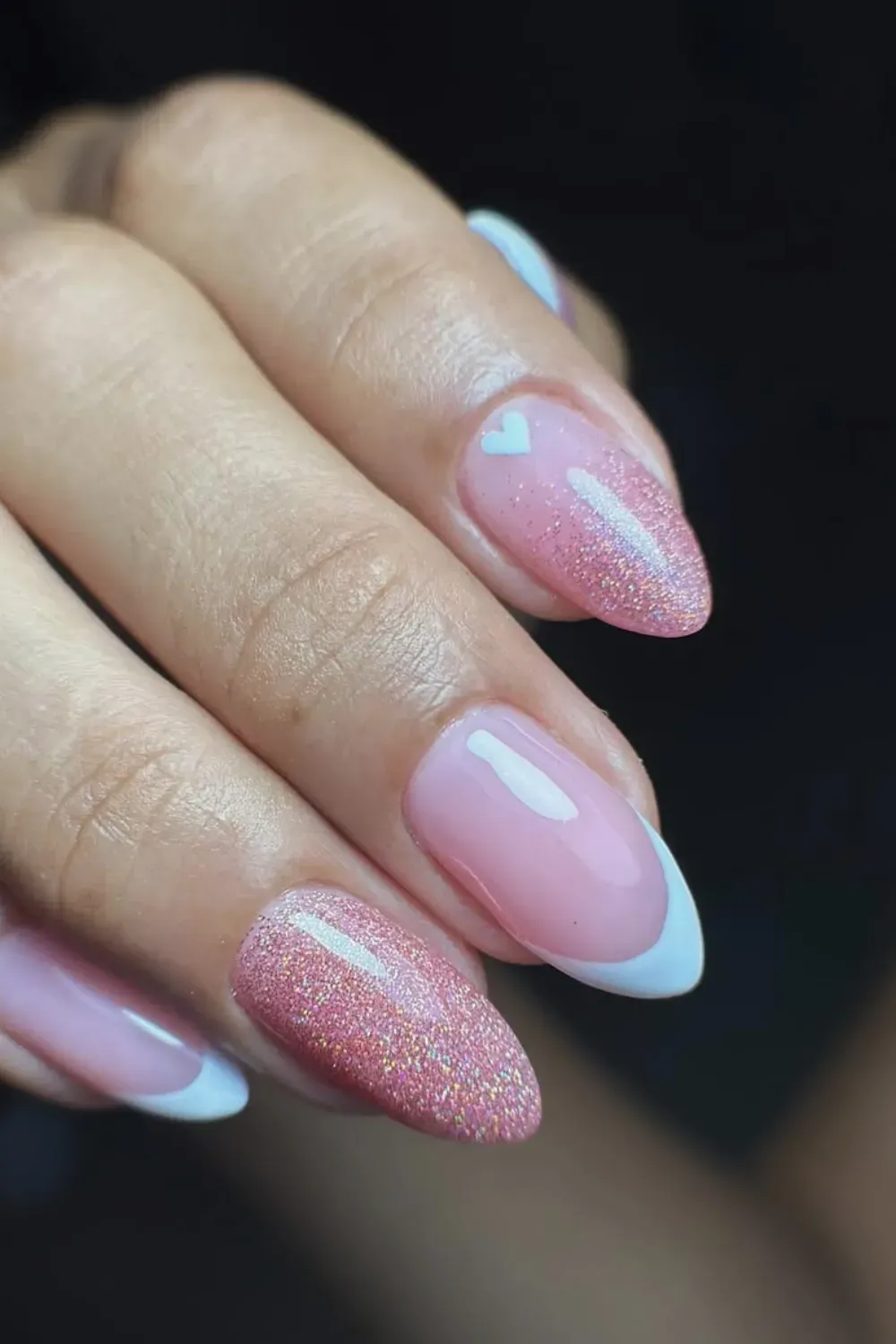 Romantic sparkly pink gradient nails paired with white French tips