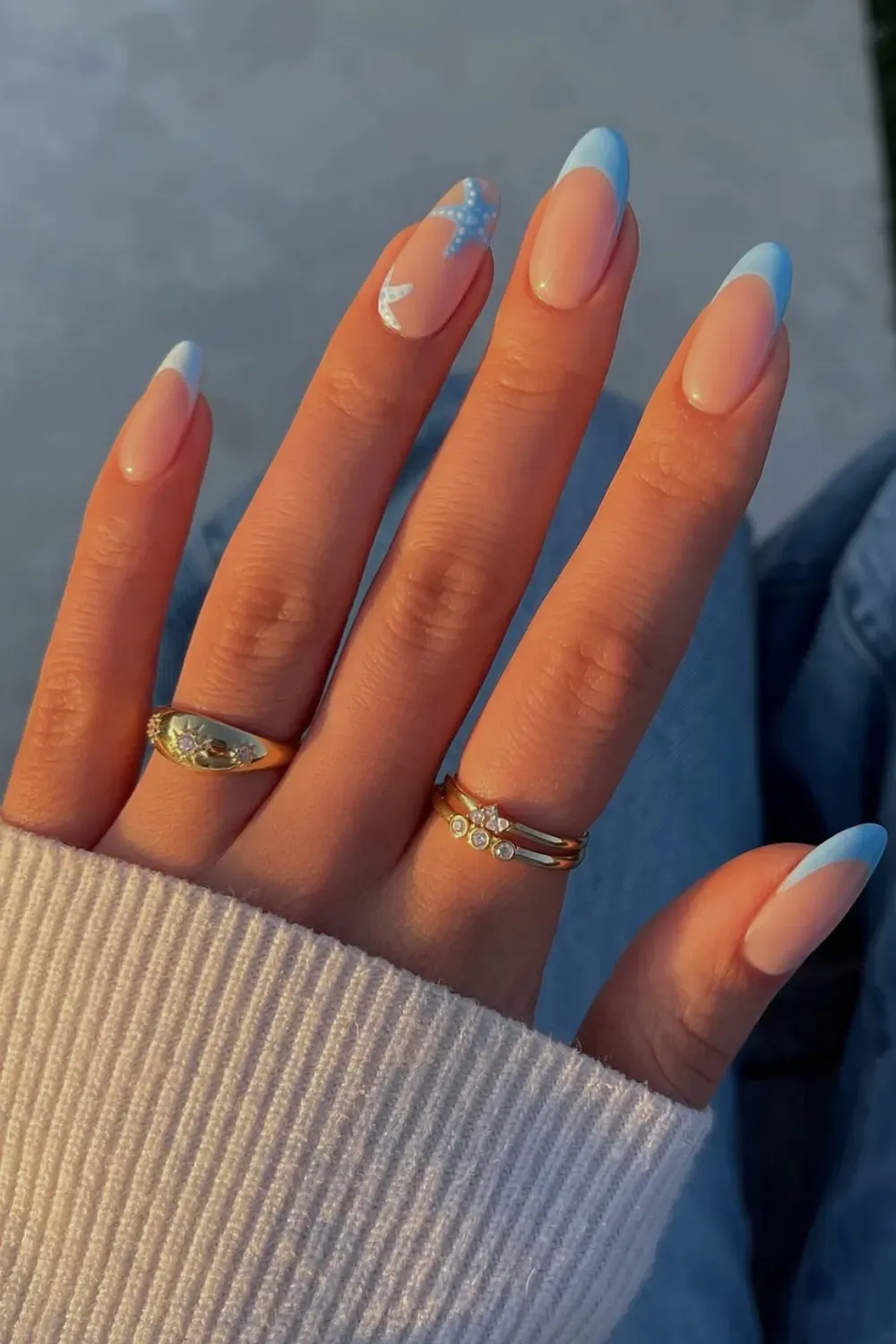 Starfish design on nails with a light shimmer finish