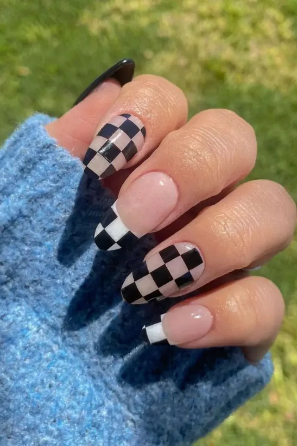 Checkerboard French Tips - Almond nails with bold black-and-white checkered French tip pattern