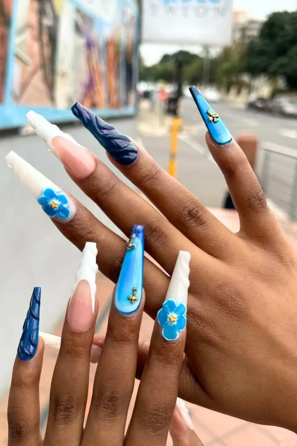 Tropical Beach Blue Nails with Floral Designs - Tropical beach-inspired blue nails with delicate floral accents