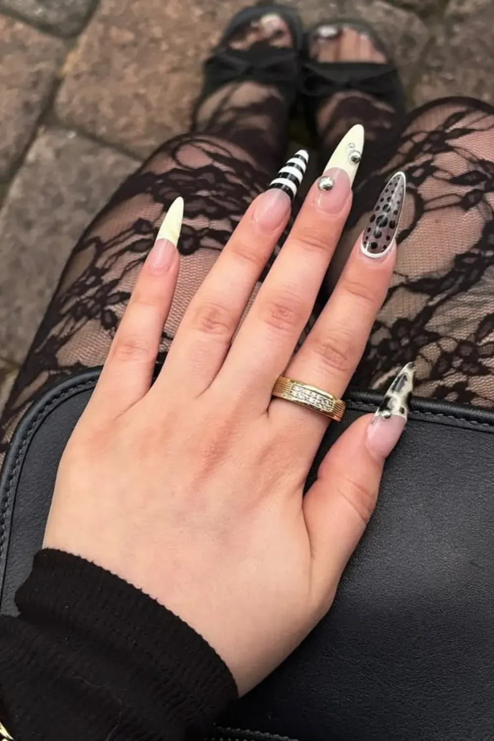 Black and White Abstract Nail Art - A striking black and white abstract nail design with geometric patterns