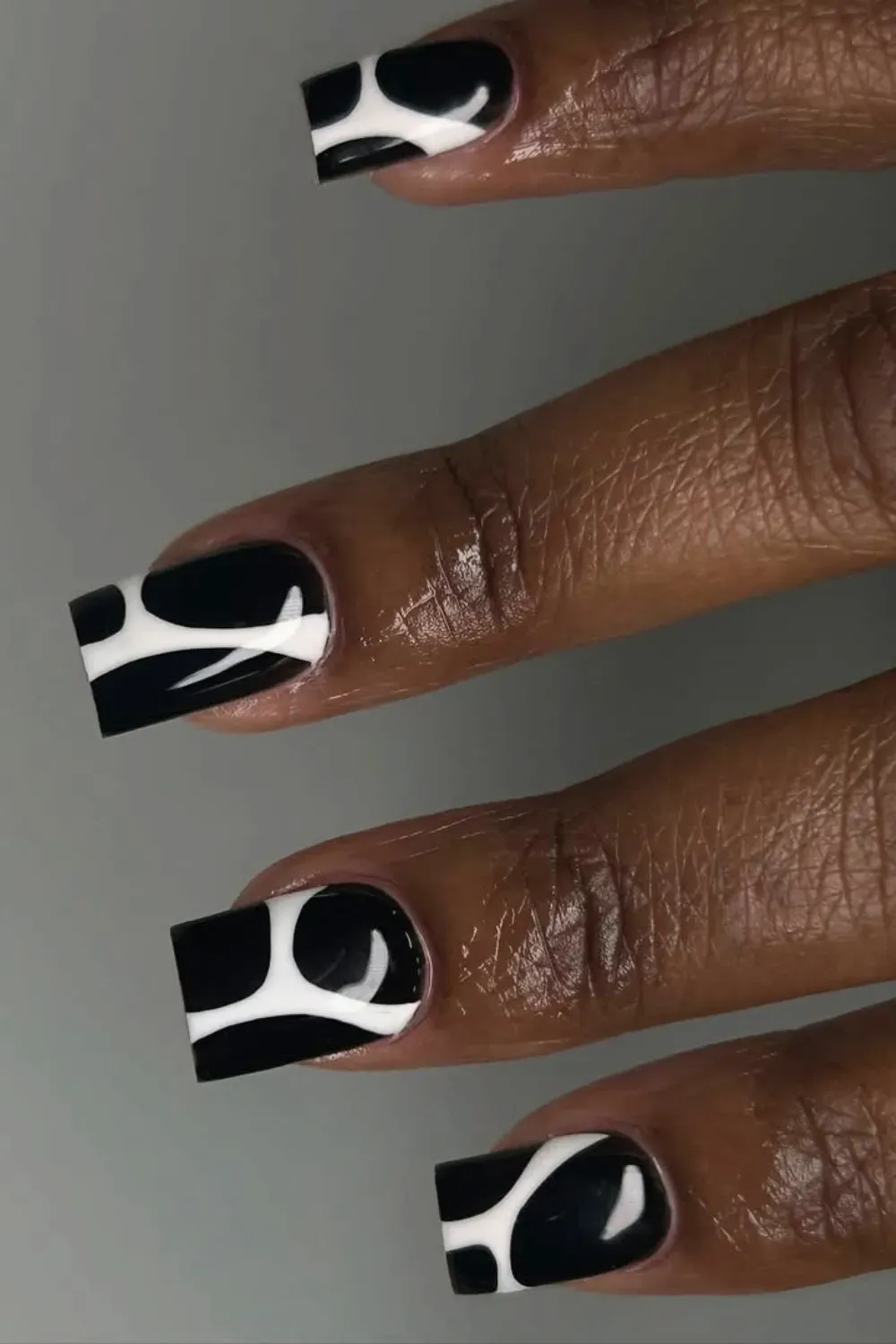 Black and White Abstract Halloween Nail Art - Chic black and white abstract Halloween nail design with bold patterns