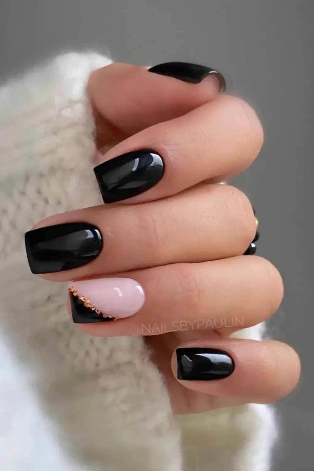 Bold Black Nails with Gold Accents - Classic black Halloween nails with eye-catching gold accents.