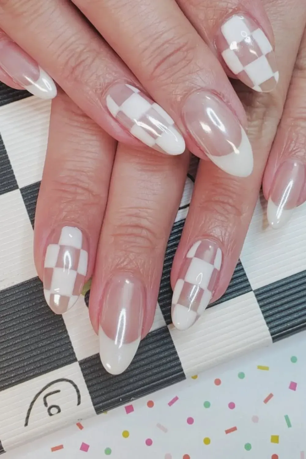 Creative checkered pattern on chrome nails with a modern twist