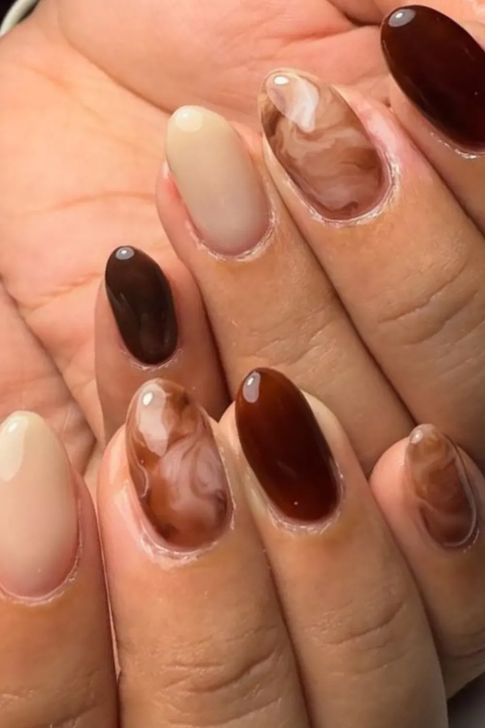 Chocolate Marble Nail Art - Elegant brown and beige marble nail art with a glossy finish, reflecting fall's earthy vibes