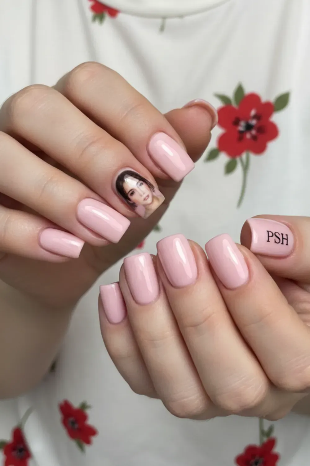  Short nails with custom portrait nail art and text for a bold yet artistic look.