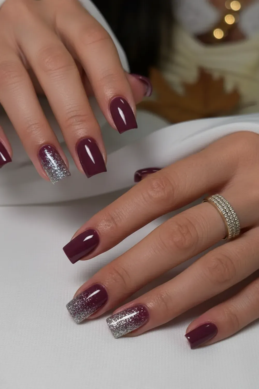 Deep Plum Nails with Glitter - Deep plum nails adorned with silver glitter tips for a stylish fall manicure