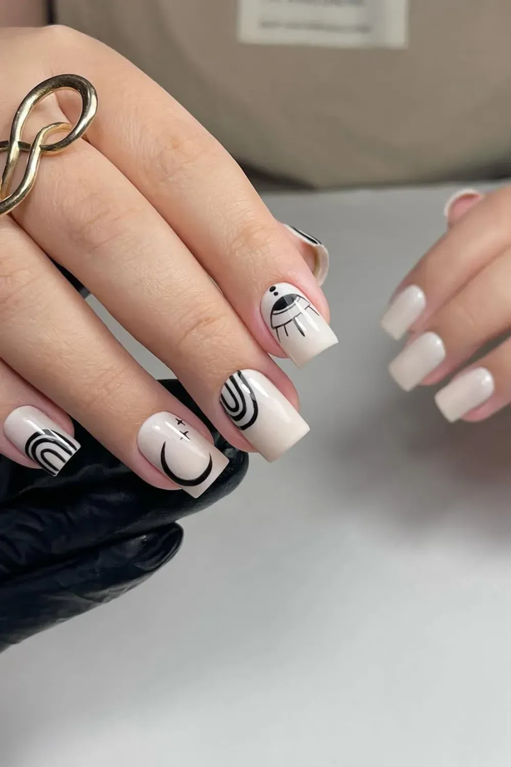 Black and white minimalist nail art with geometric designs