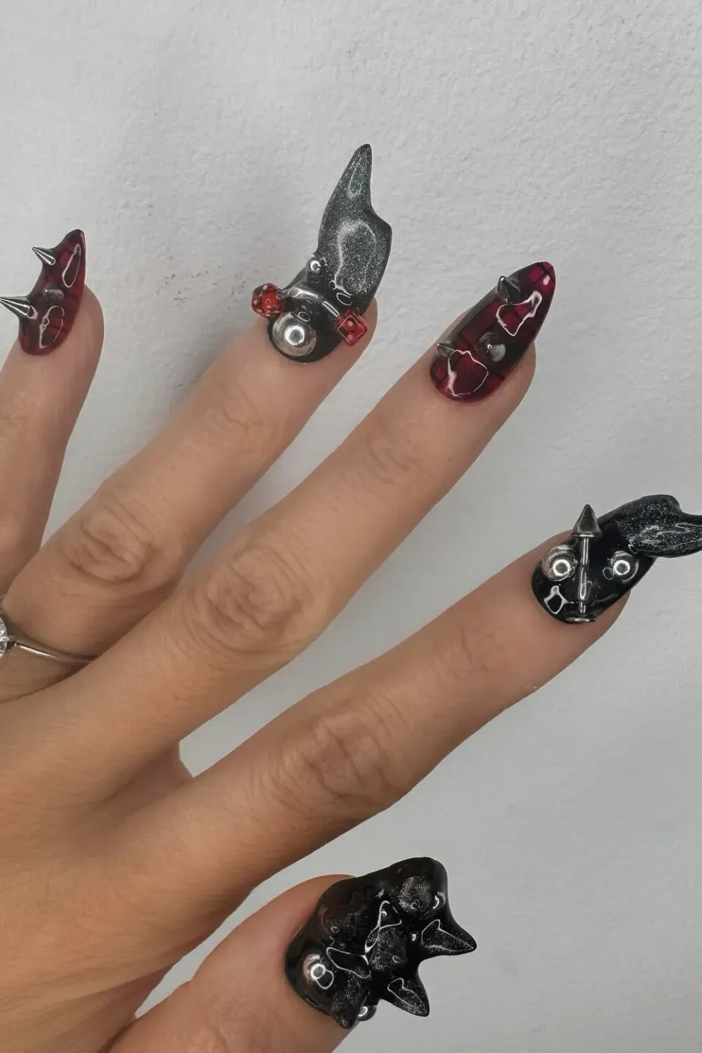 3D Gothic Bat Halloween Nails - Bold 3D gothic nails featuring bats, sharp tips, and red accents for a fierce Halloween vibe