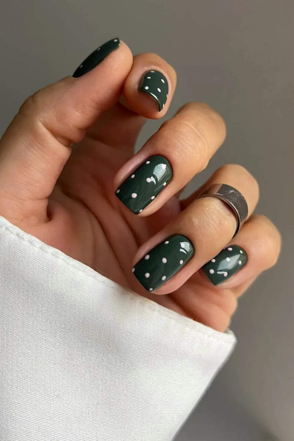 Green Nails with White Dots - Trendy green nails adorned with delicate white dots, a stylish and modern design