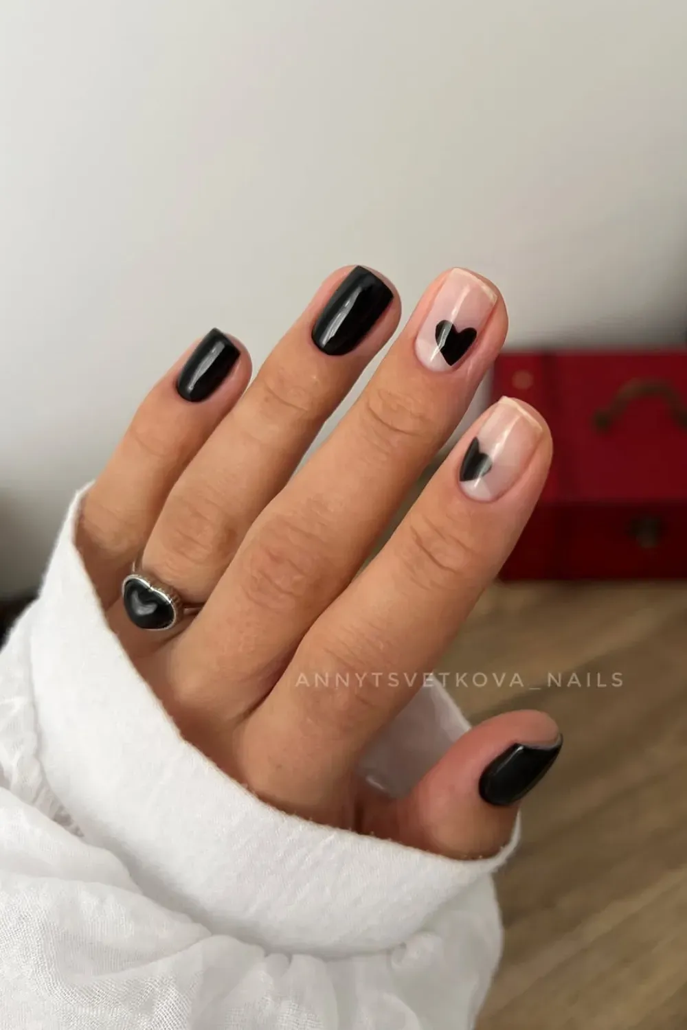 Black and Nude Heart Nail Art - Stylish black heart nail art design with nude base, perfect for a trendy fall manicure