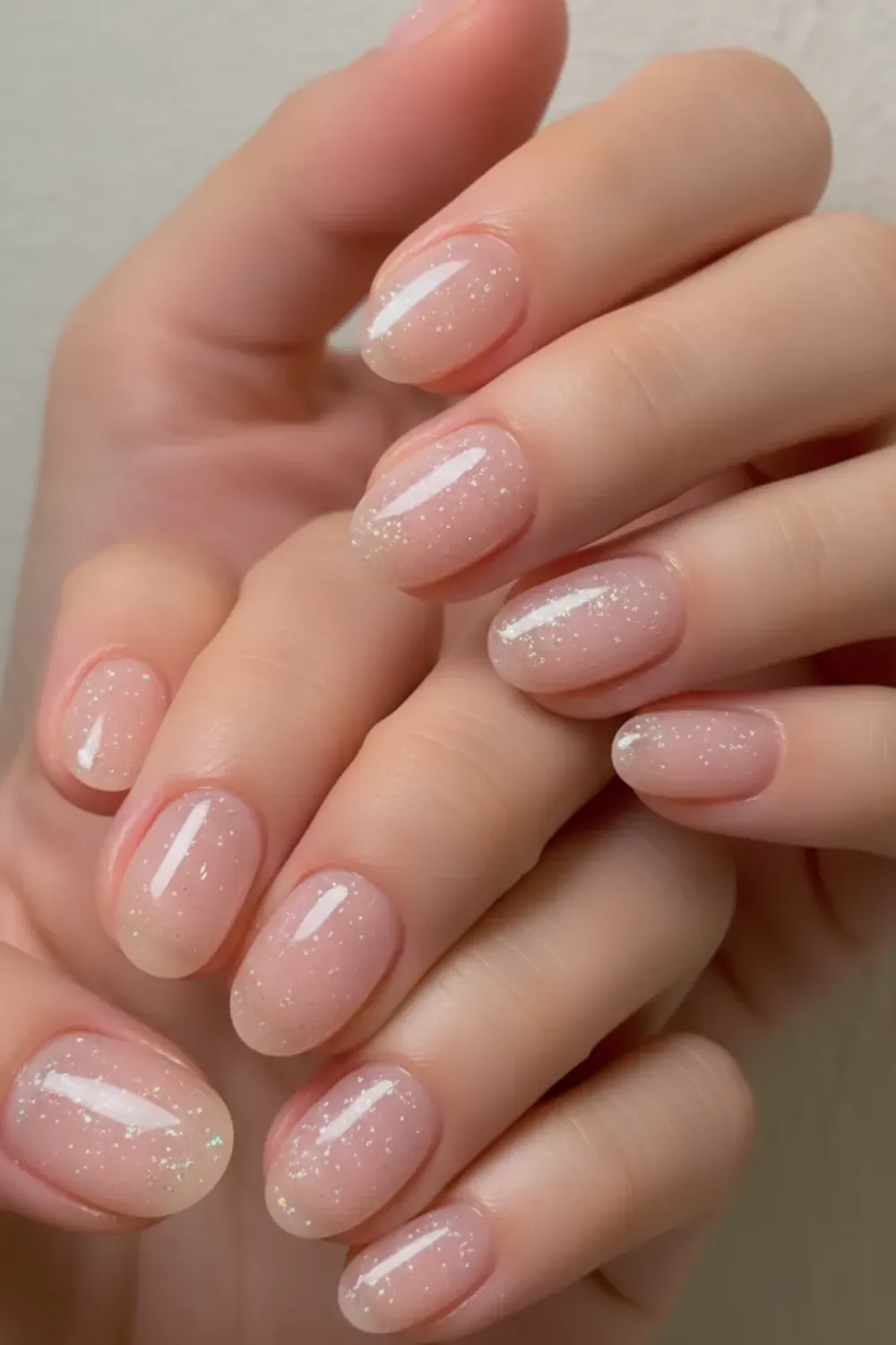  Jelly nails with a subtle shimmer effect on short nails for a fun and trendy look.