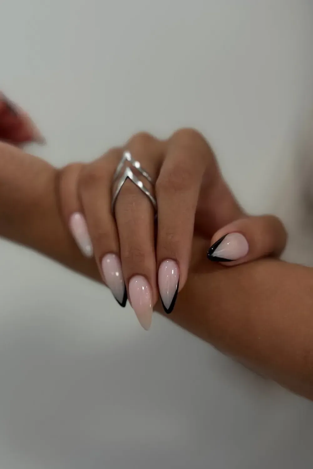 Fall Nail Art Design with Black Tips - Elegant fall nail design featuring black tips on nude nails with a chic, minimalist aesthetic
