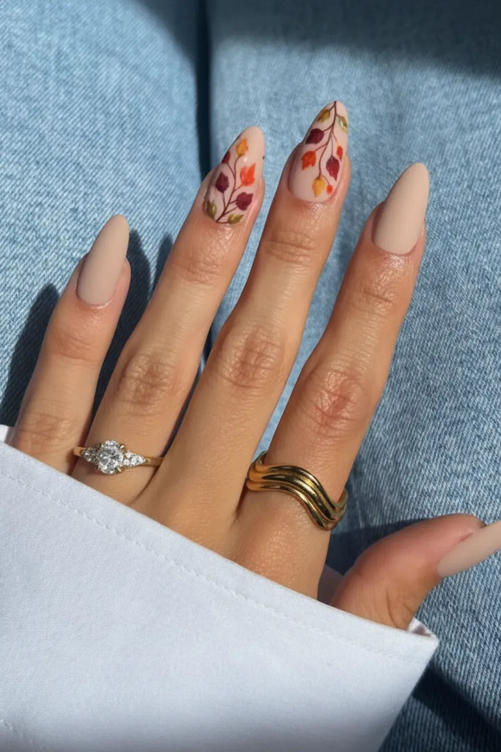 Neutral Beige Fall Nails with Foliage - Elegant neutral beige nails with autumn foliage accents for a chic fall look