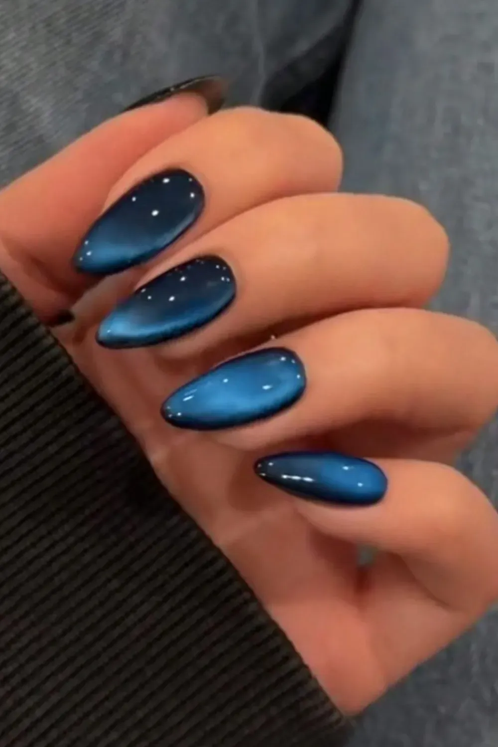 Ombré Blue Nail Art - Mesmerizing blue ombré nails for a chic and magical Halloween style.
