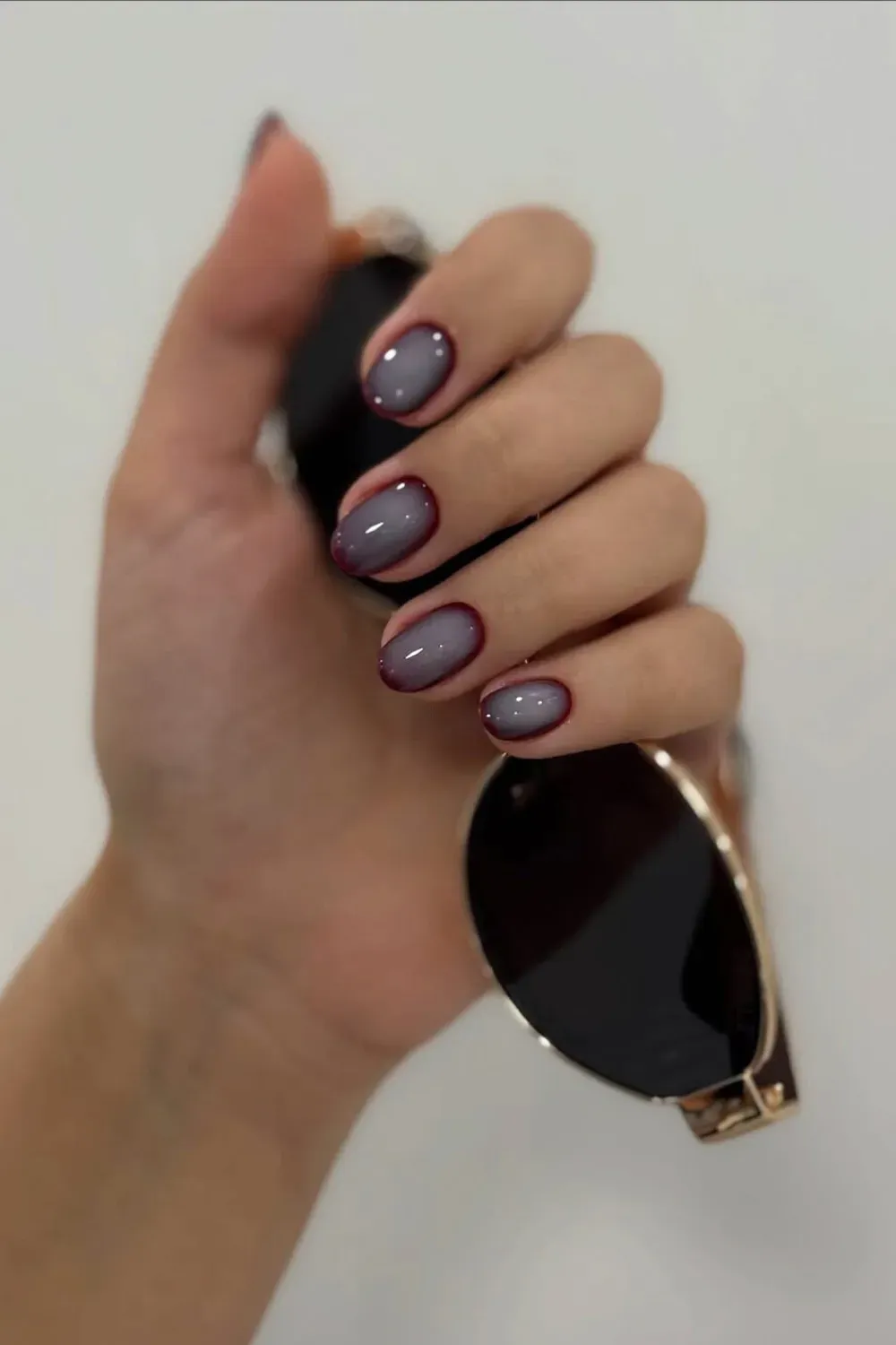 Ombre nails in burgundy with a glossy finish