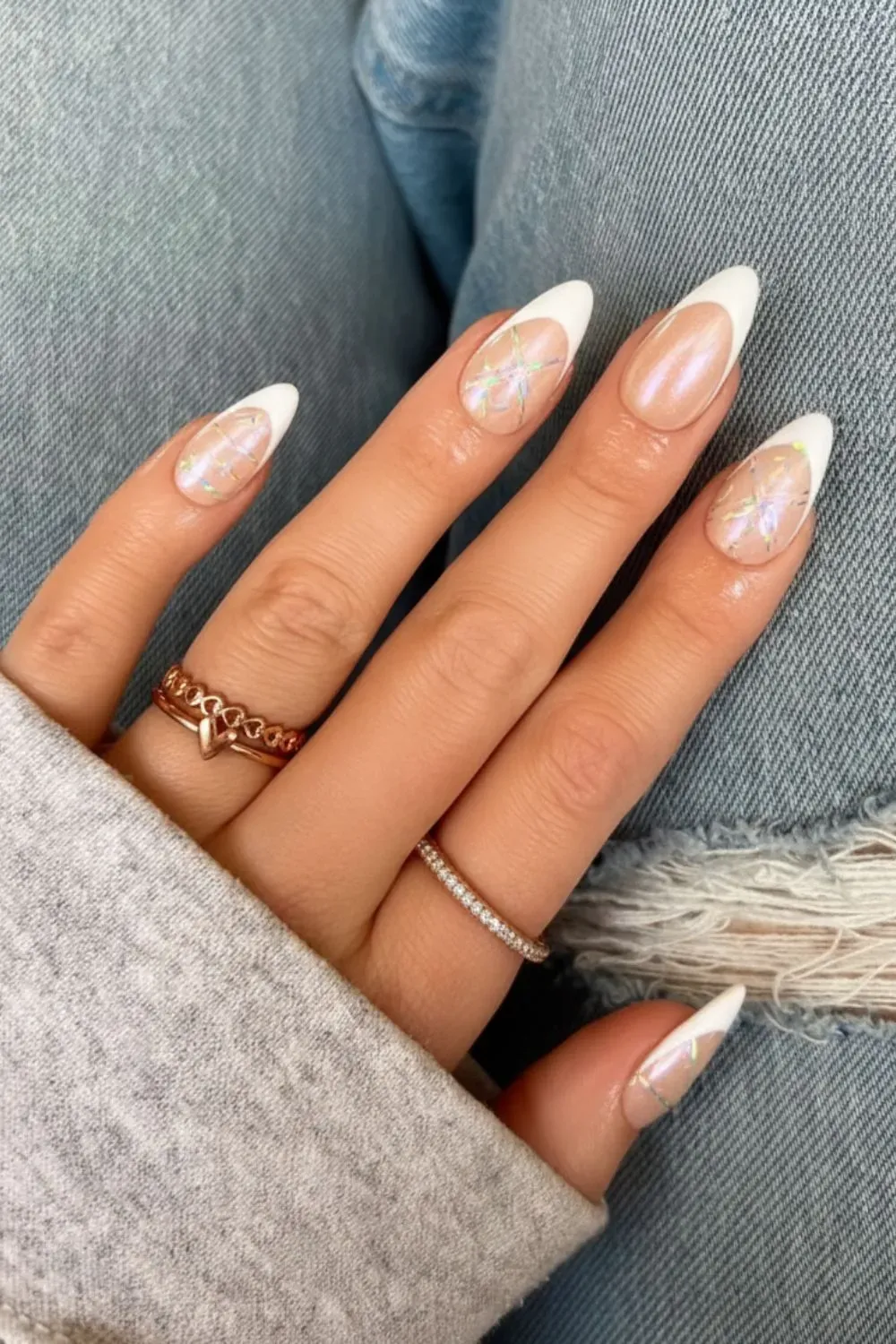 Peachy chrome nails with holographic accents for a bold look.