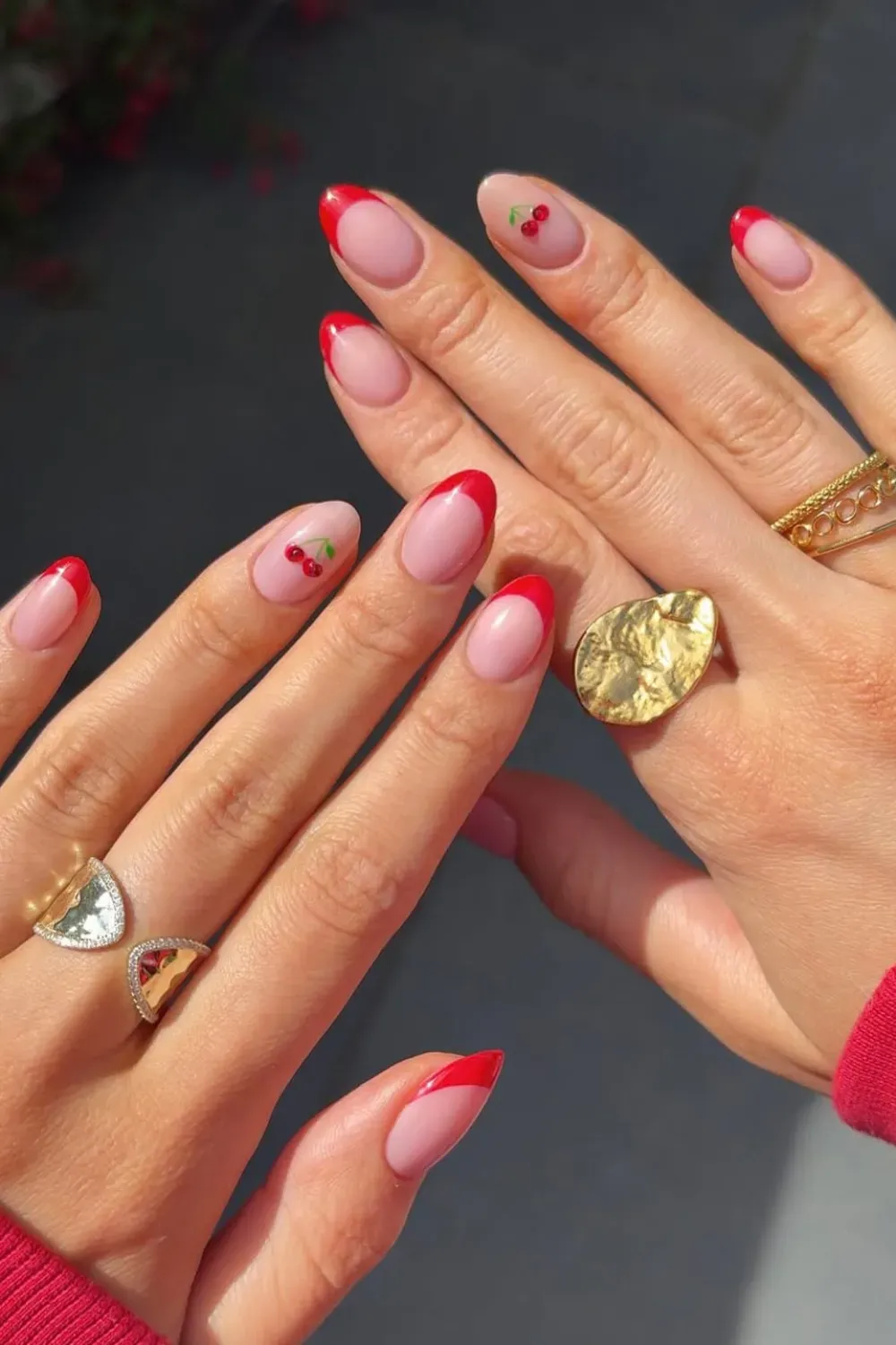 Red French Tips with Cherry Accent - Bold red French tips with a cute cherry accent nail