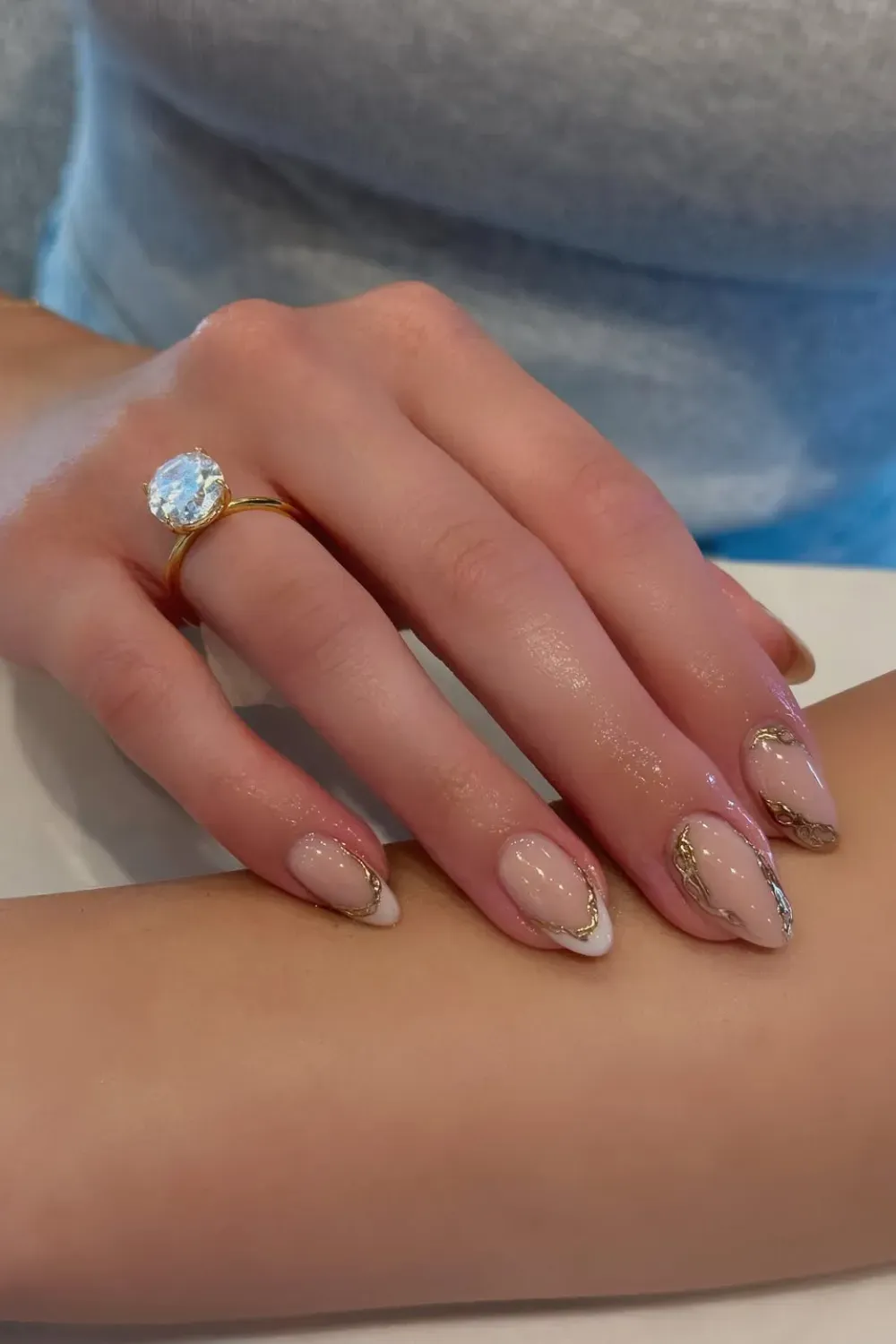 Soft French Tip Nails with Gold - Elegant French tip nails with a clean base and gold accents for a sophisticated look