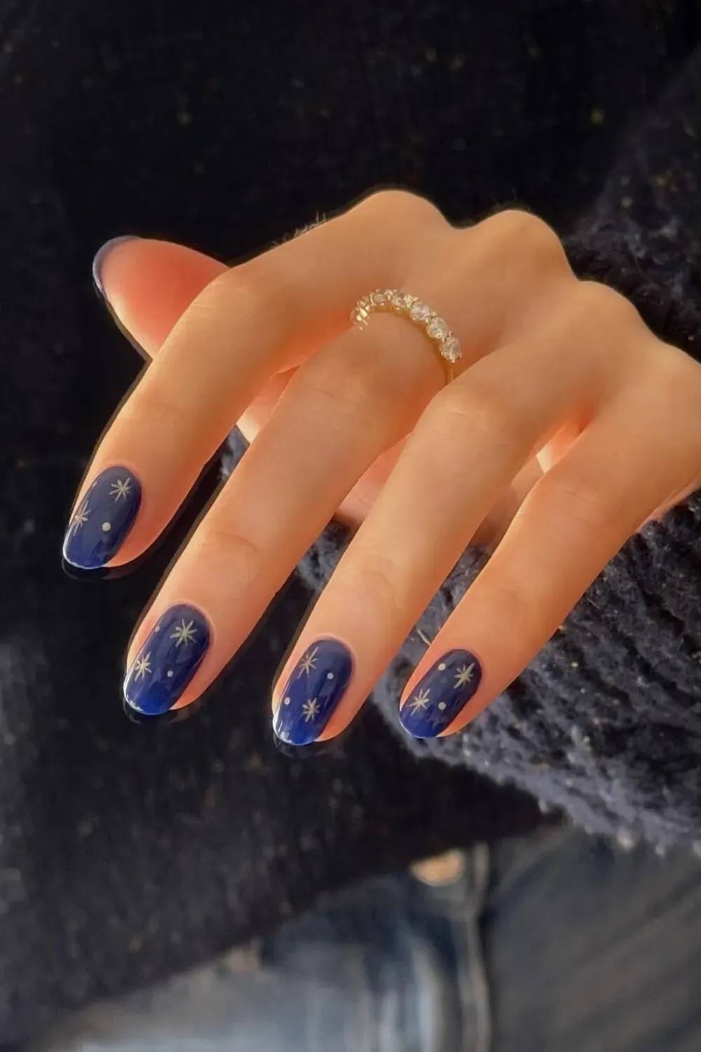 Starry Night Nails – Dark blue nails with star designs and metallic accents.