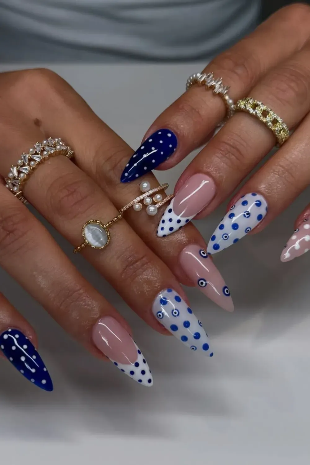 Stiletto Nails with Blue Gradient – Stiletto nails featuring a gradient from light to dark blue.