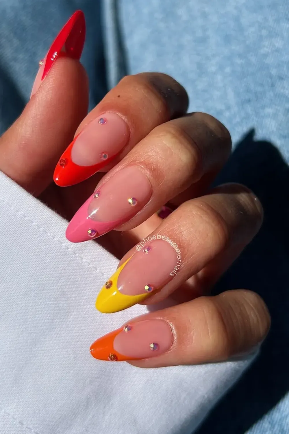 Vibrant Color Pop French Tips - Neon pink, orange, and yellow color pop French tips with rhinestone embellishments