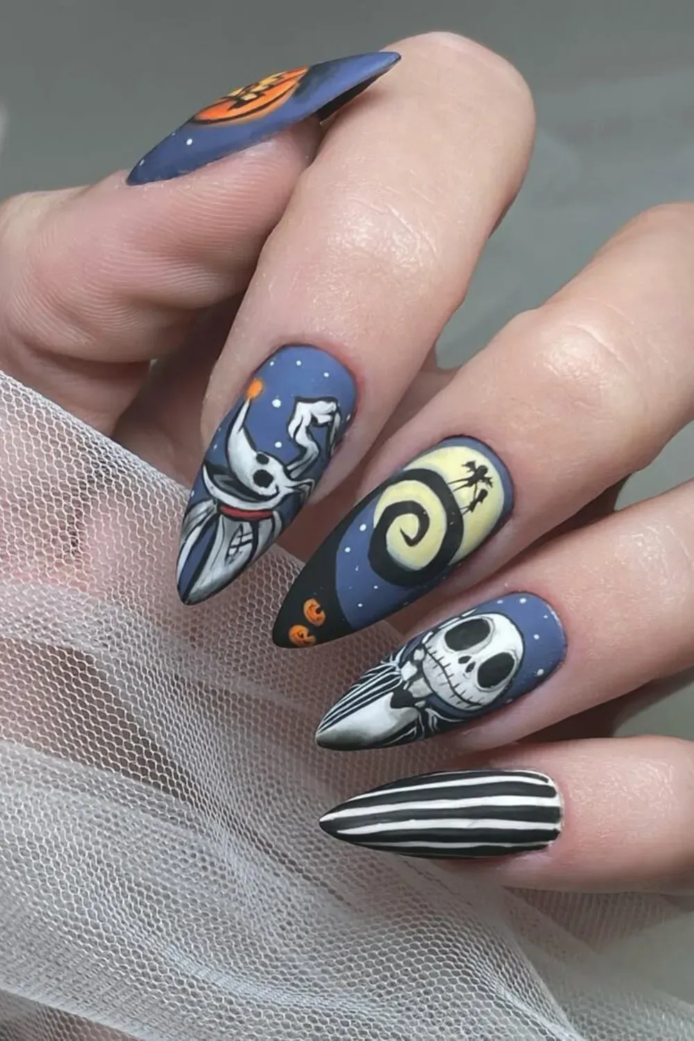 Whimsical Pumpkin Halloween Nails - Fun and playful pumpkin-themed Halloween nails with bright colors and cheerful designs