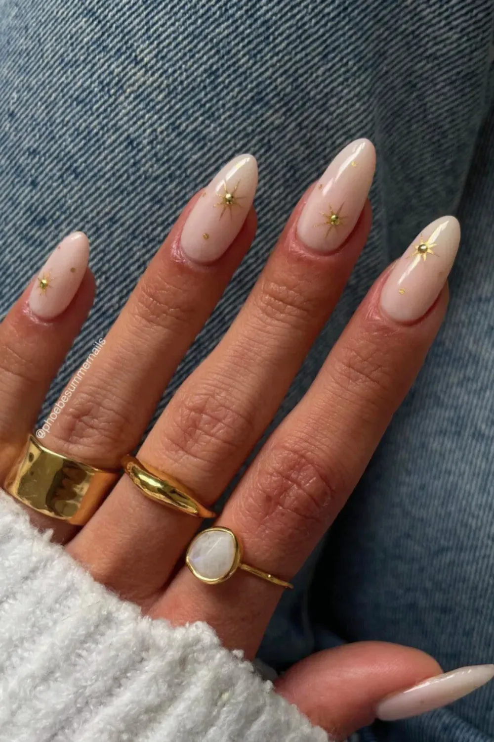 Celestial Gold Star Milky Nail Art - Bespoke Design - Long almond-shaped nails in a soft milky polish with delicate small gold foil stars and dots creating a celestial design.