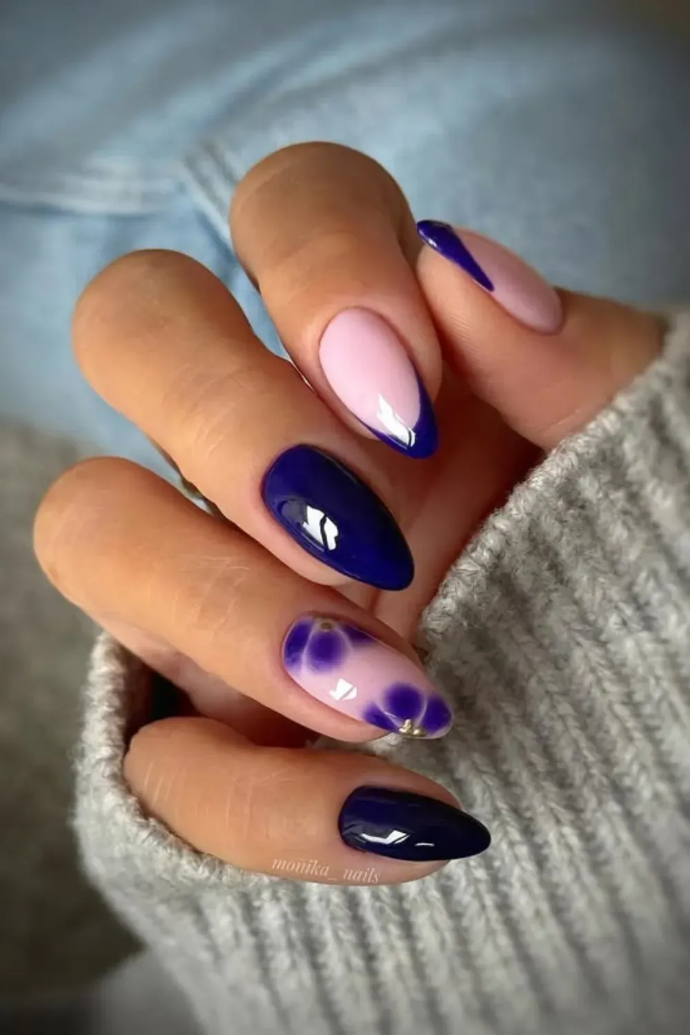 Abstract Navy and Pink Aura Nails - Almond-shaped nails featuring solid navy, pink with a purple aura effect, and a modern asymmetrical navy French tip.