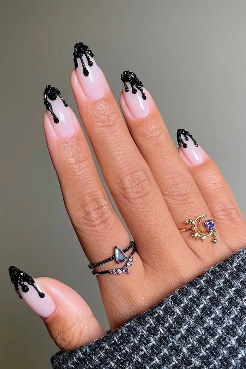 Black 3D Drip French Manicure - Almond/stiletto nails with a pink base and a dramatic black gel "drip" effect along the free edge, resembling liquid.