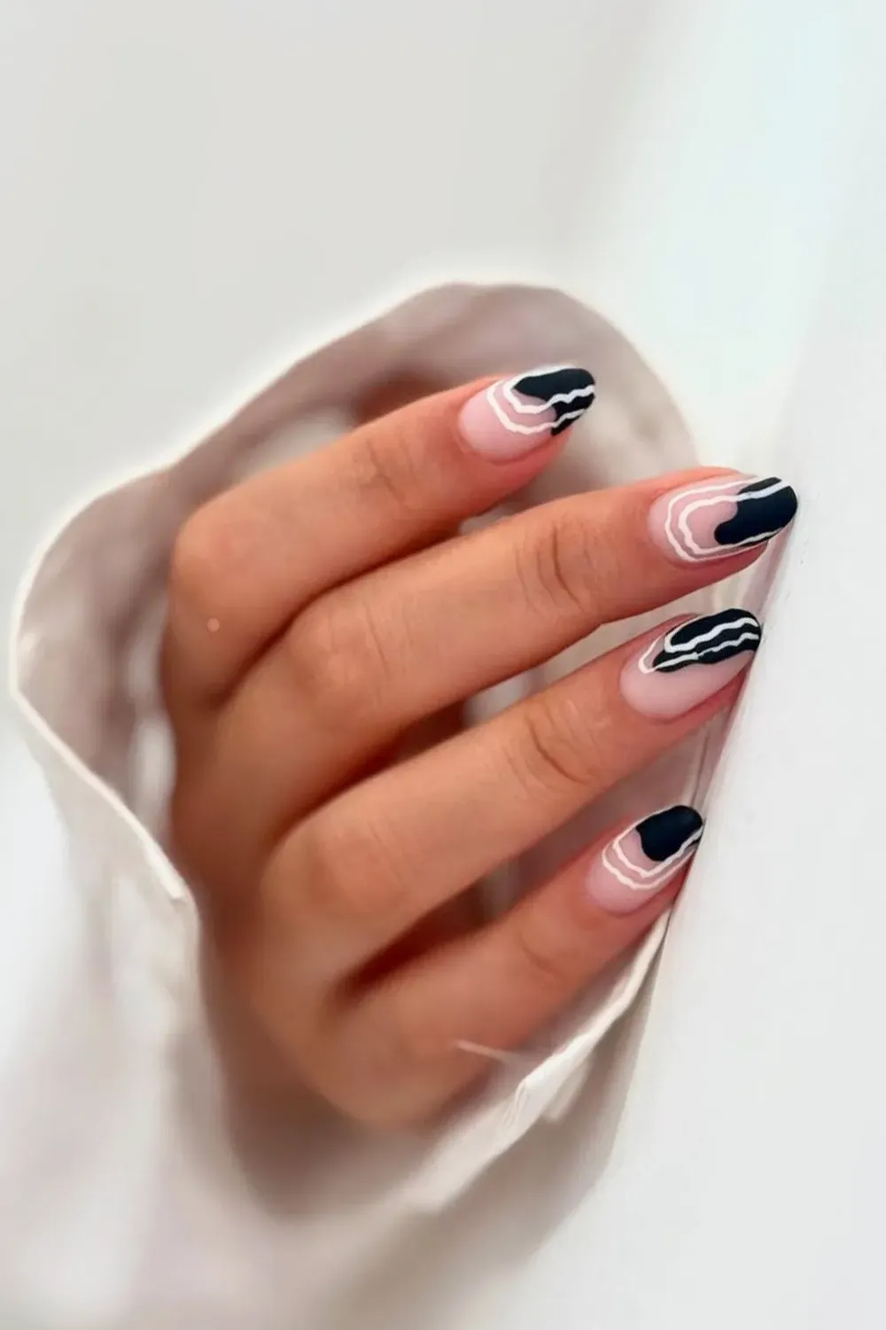 Black and White Abstract Waves: Minimalist black and white abstract wave design over a sheer, natural base for a contemporary, edgy style.