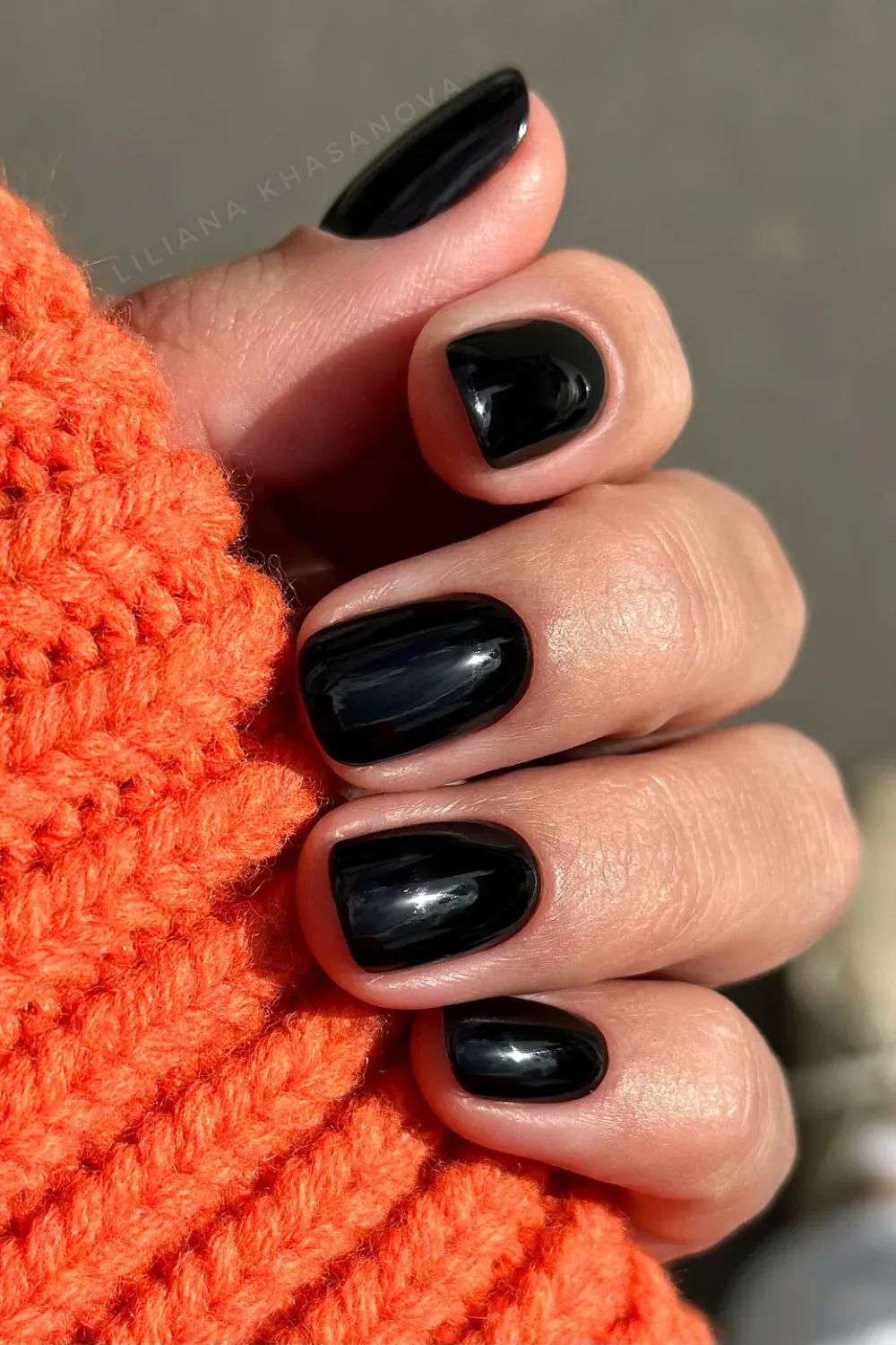 Classic Glossy Black: Timeless glossy black manicure with sleek, short nails or subtle length, ideal for any occasion.